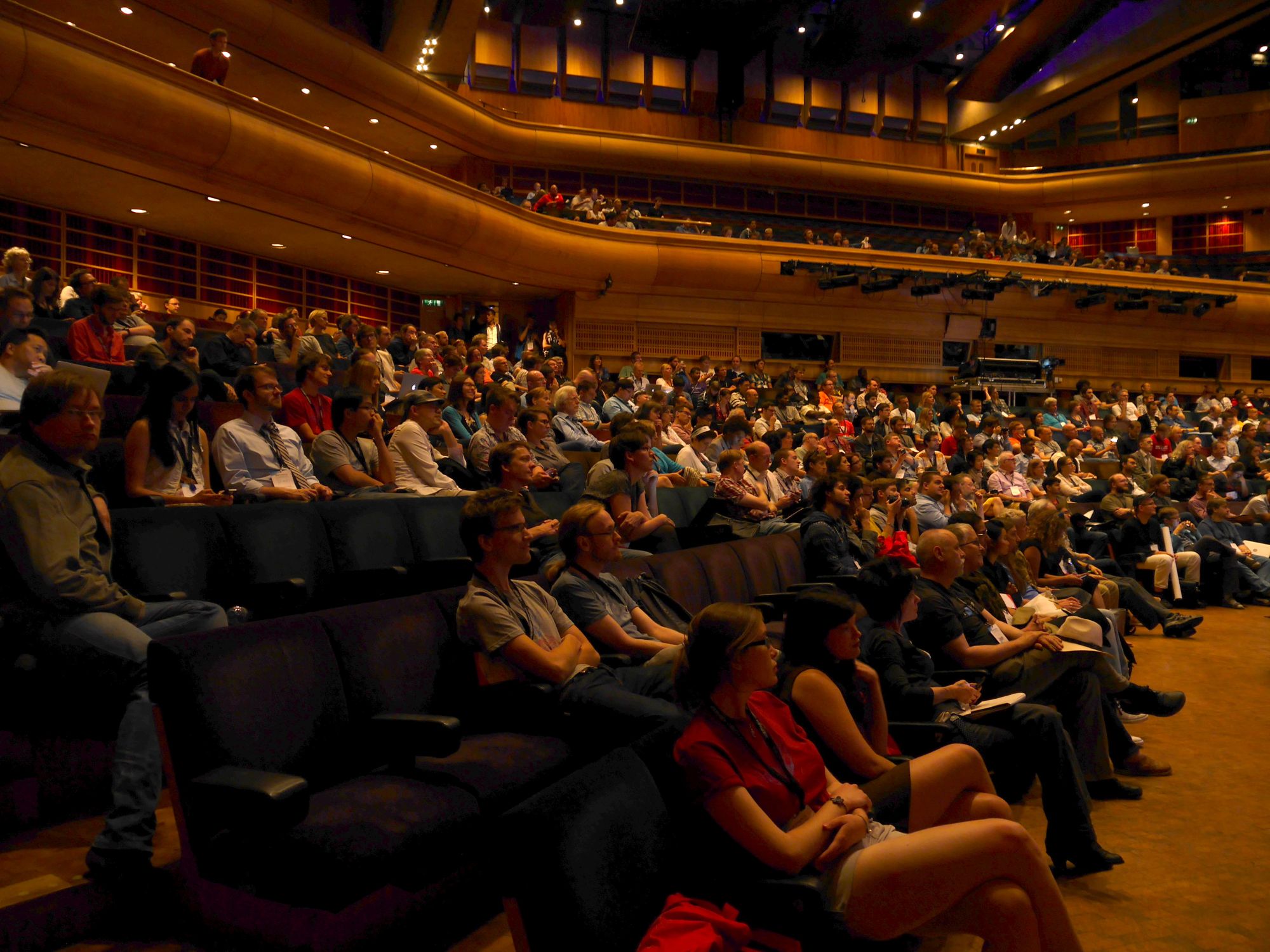 Delegates listening in a large conference hall