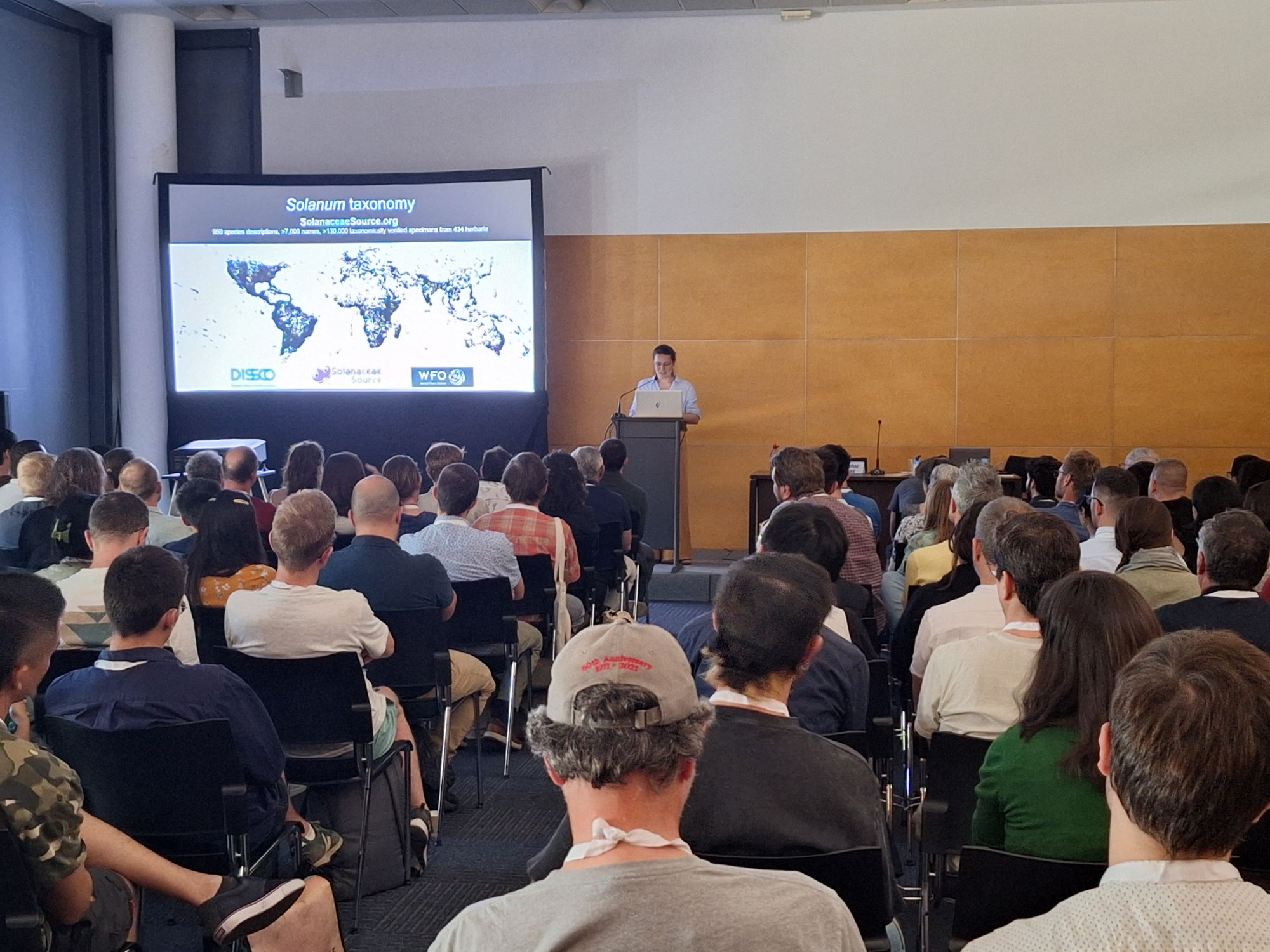 A speaker presenting to an audience