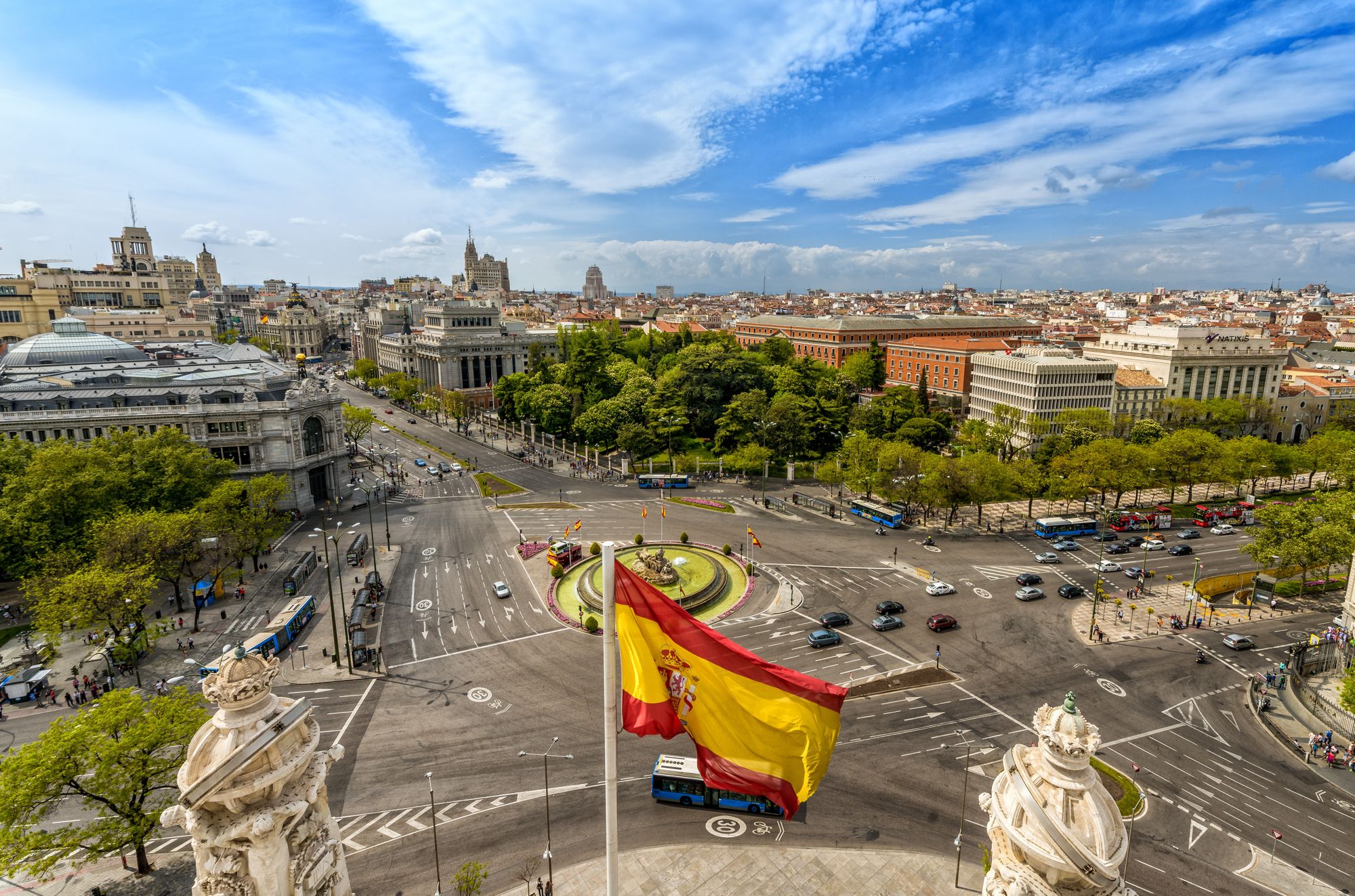 Plaza de Cibeles in Madrid with the Spanish flag